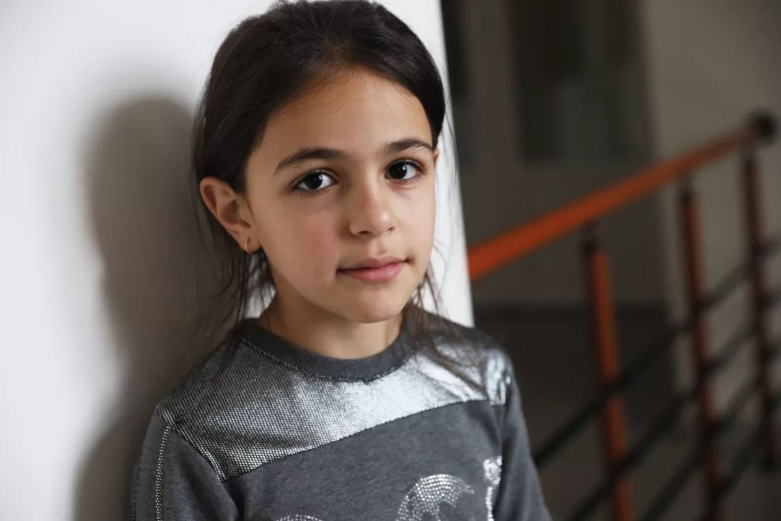 A young girl posing for the camera
