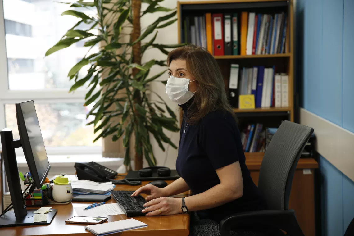 Maya Simonyan is sitting at her des at UNICEF Armenia's office. 