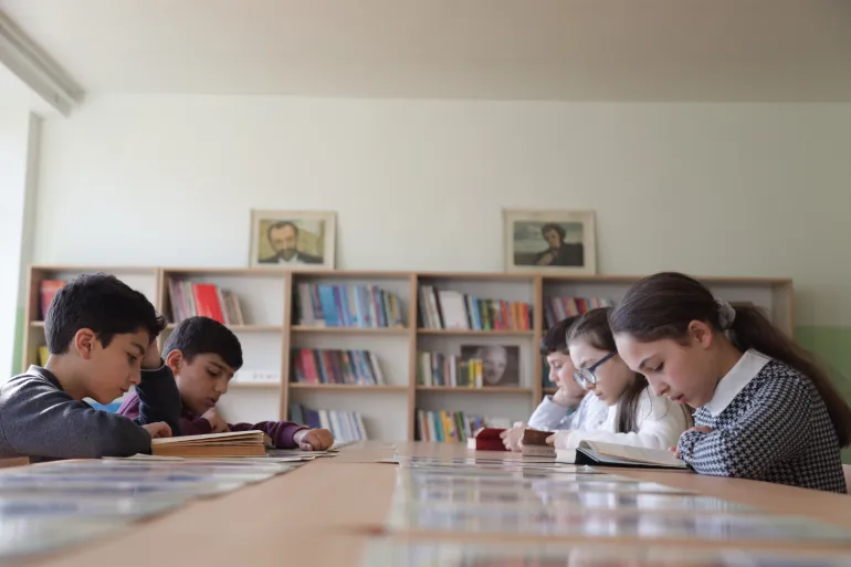 At Goris school #2, the library is bustling. One after another, students go through the bookshelves, looking through the books and take their turn at the main table to read. They now have a cozy corner in the school to spend some quality time after and between classes.