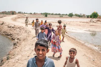 Children seen on the street in the inundated region of Geokaloi Village in the Southern Pakistani province of Sindh. 
