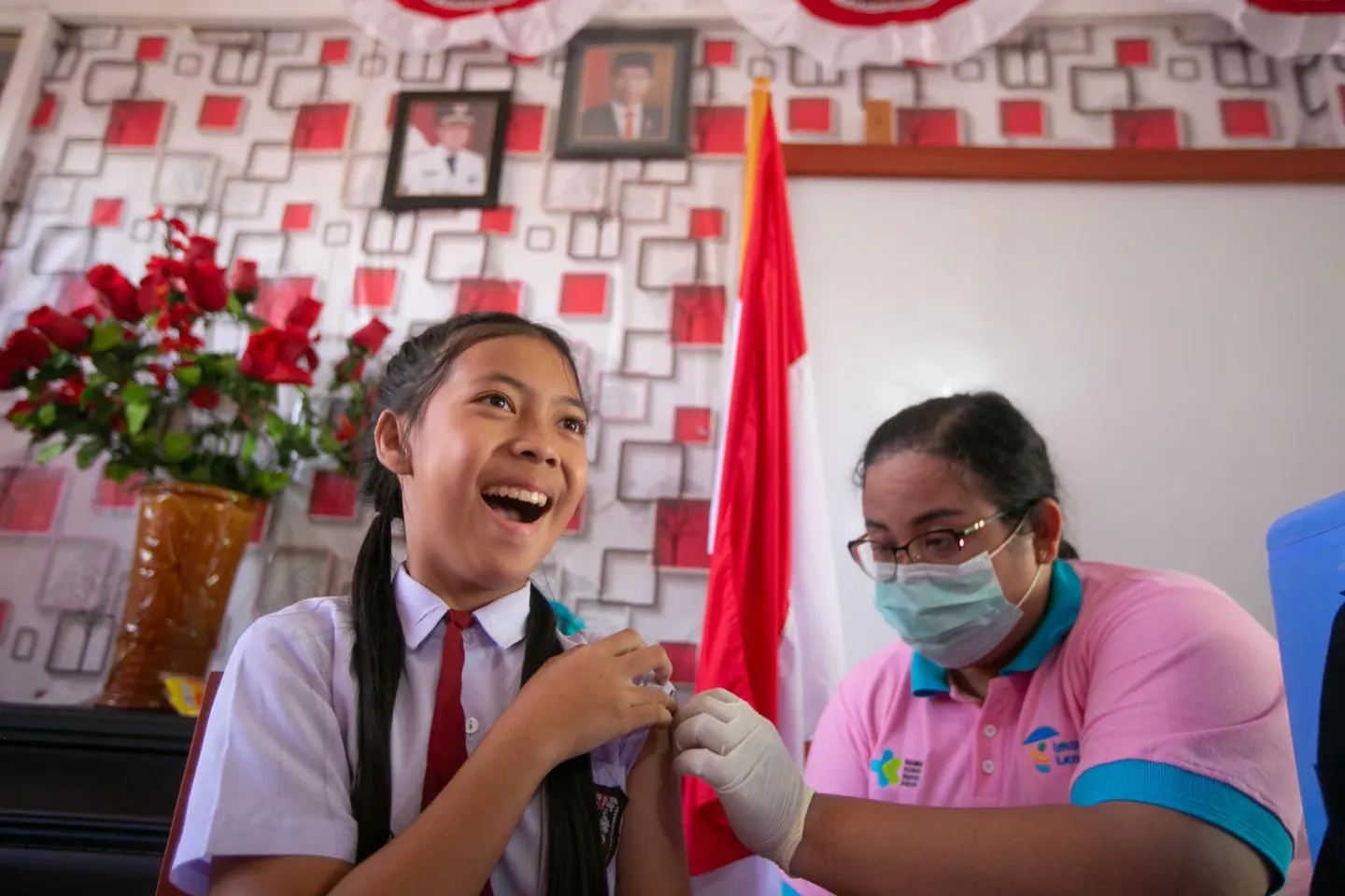Students are immunized by officers during an event for the nationwide scale-up of Human Papilloma Virus (HPV) immunization, held at SD Negeri 8 Tondano, Minahasa, North Sulawesi, Indonesia