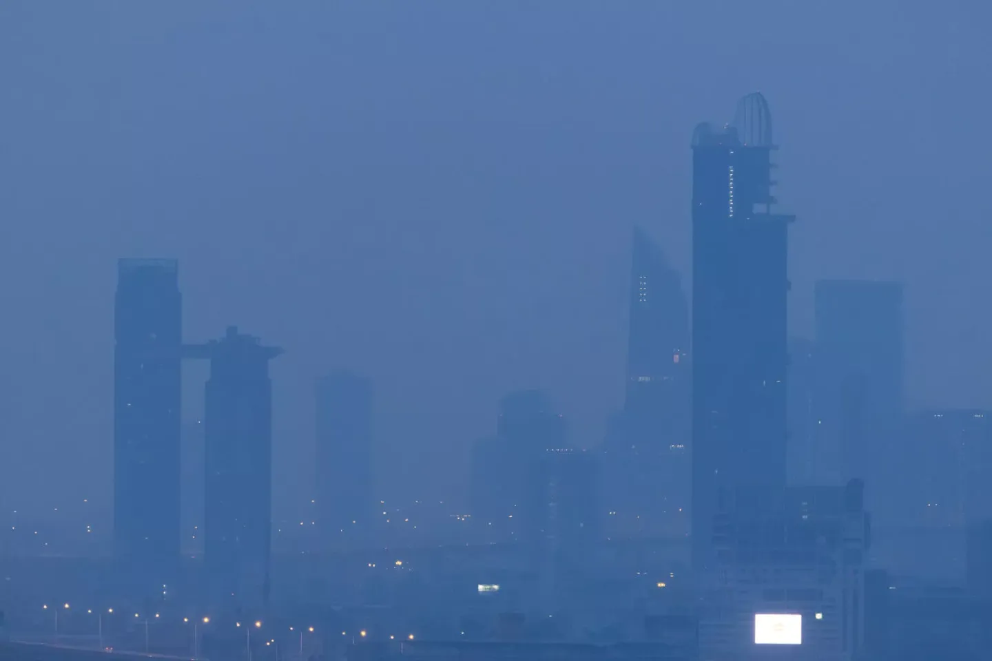 Bangkok's high-rise buildings in the morning, covered in PM 2.5 dust on a day when pollution levels exceeded the standard, starting to impact health.