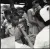 A woman health worker gives a boy an anti-tuberculosis BCG vaccination, while other children and women wait their turn, at a school in Bulacan province.