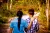 A teen boy and woman are walking