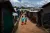 Two children with unicef backpacks walk away from the viewer