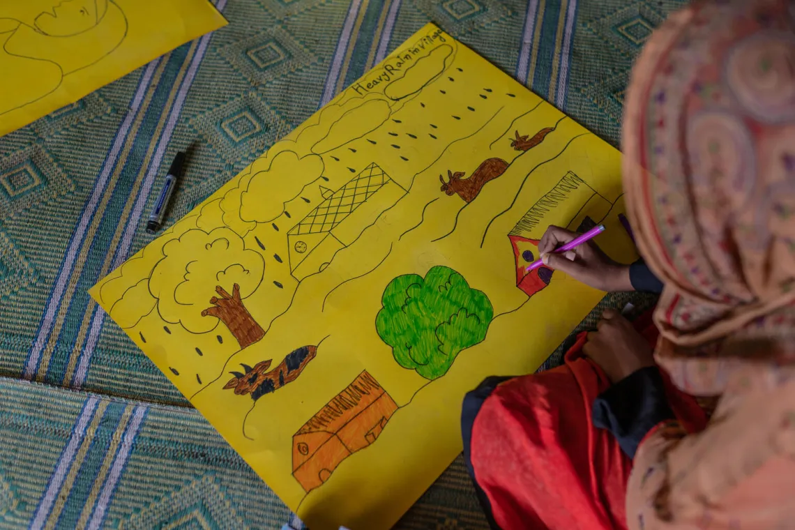Children drawing at the UNICEF-supported Children's Safe Space