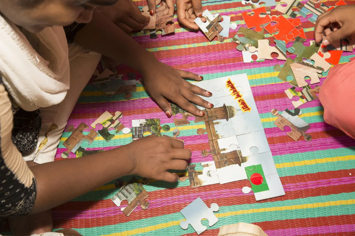 children playing puzzle