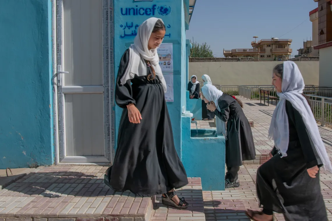 students enter newly constructed latrines
