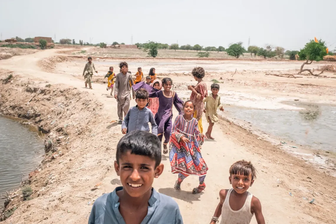 Children seen on the street in the inundated region of Geokaloi Village in the Southern Pakistani province of Sindh. 