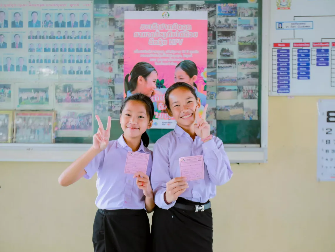 V for vaccinated! Students in Lao PDR celebrate after getting their HPV vaccine.