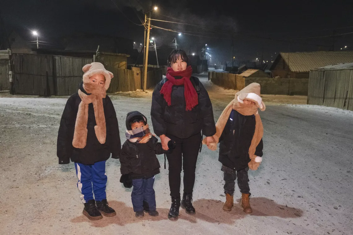 Ariunsaikhan O., 29, a single mother of three, walks her children to school and kindergarten in Ulaanbaatar&rsquo;s Bayanzurkh district.