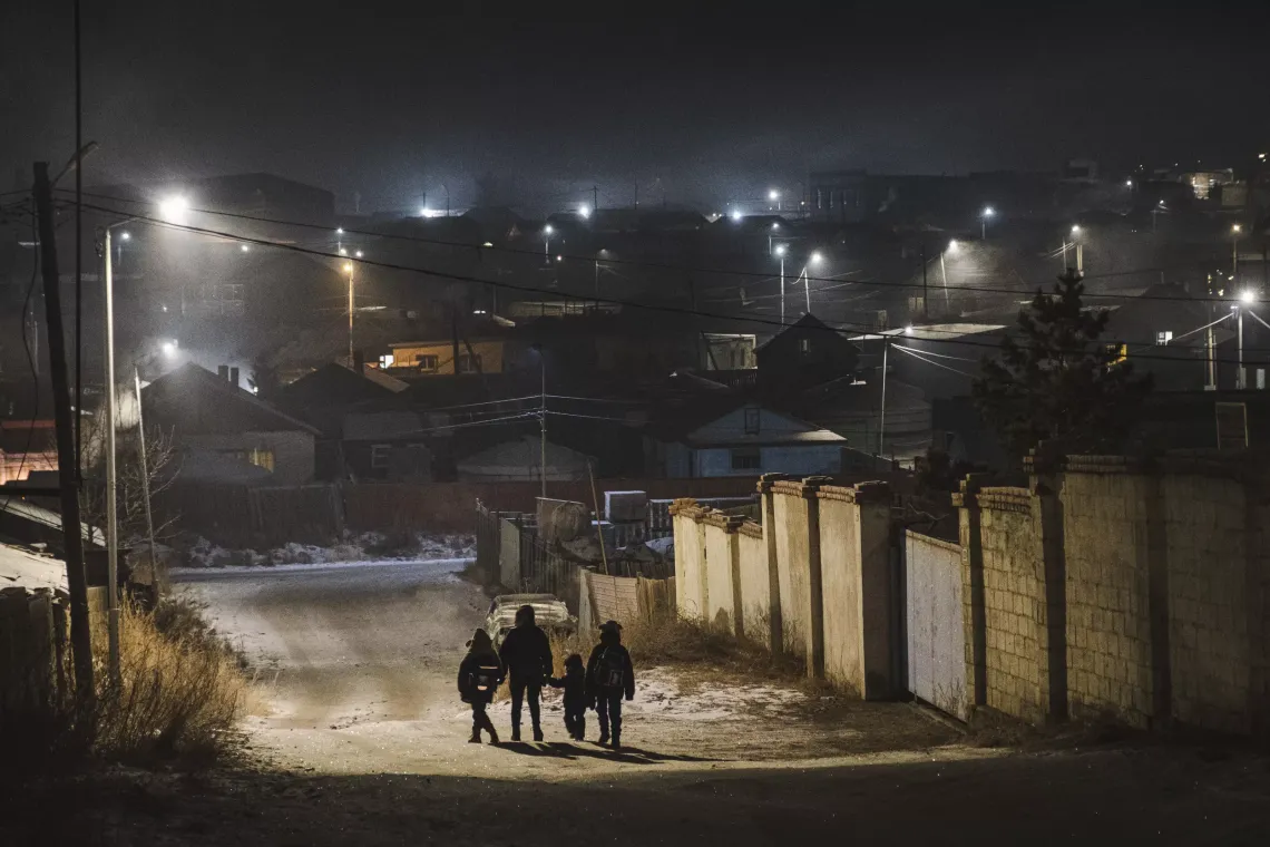 Ariunsaikhan O., 29, a single mother of three, walks her children to school and kindergarten in Ulaanbaatar&rsquo;s Bayanzurkh district. 