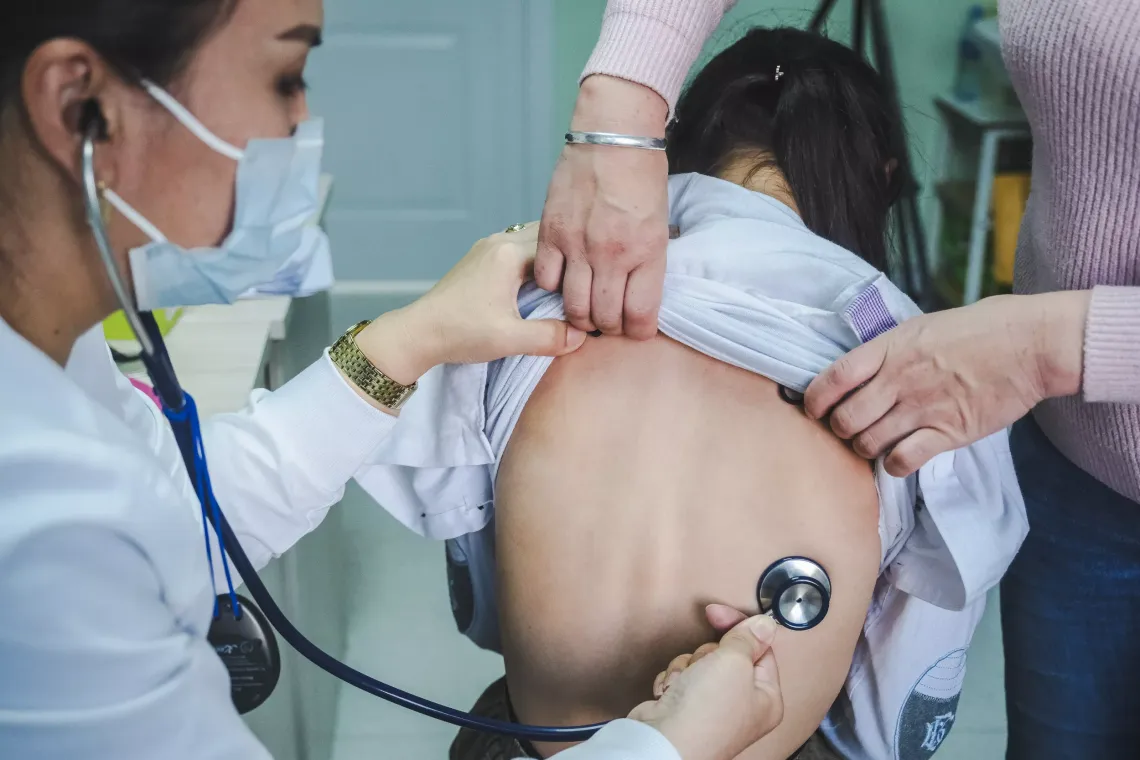 Dr. Oyunzul conducts a routine check-up for Temuunzaya Baatarsukh at the Bayanzurkh District Hospital.