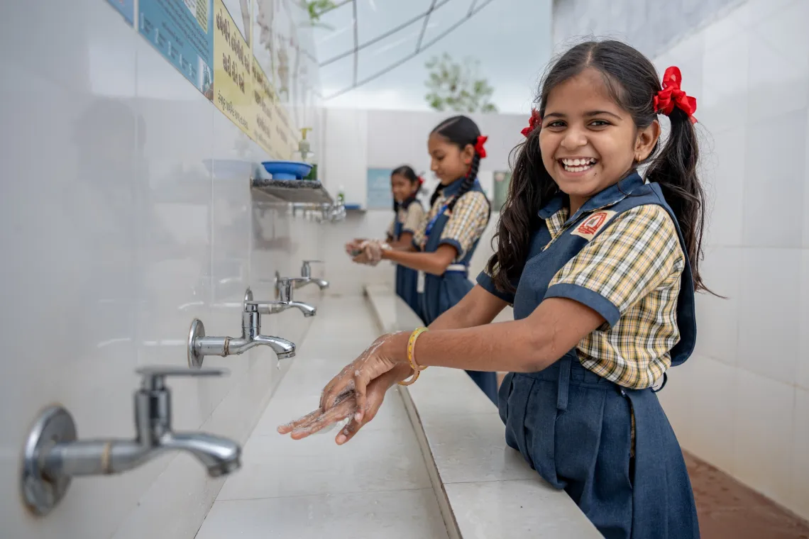 Children washing their hands