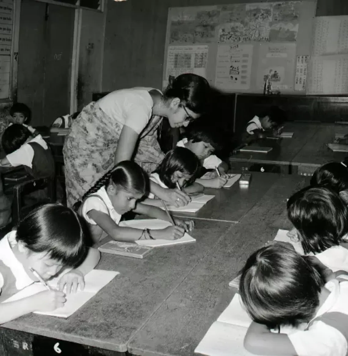Teach and students in classroom