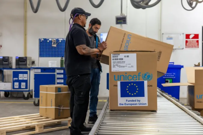 UNICEF humanitarian supplies being loaded onto an aircraft for delivery to communities in need.