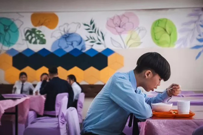 A student is having his lunch
