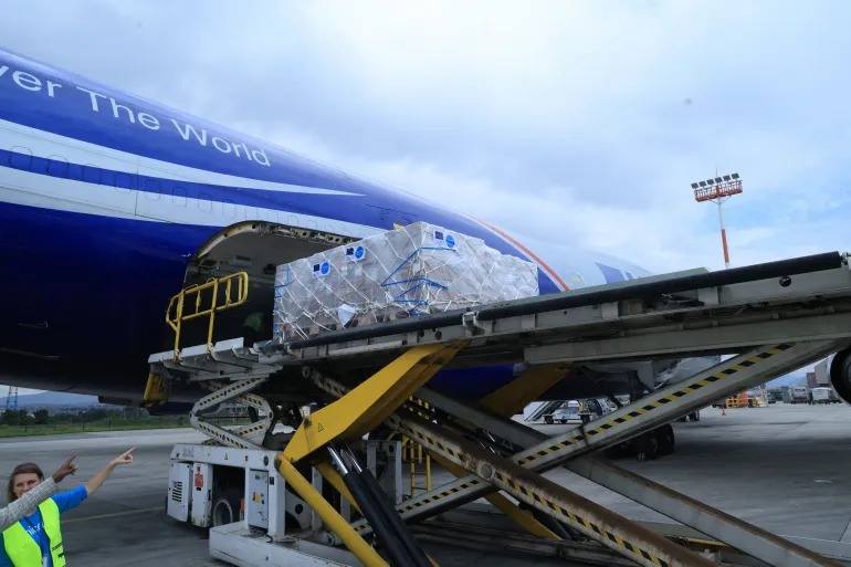 UNICEF humanitarian supplies being loaded onto an aircraft for delivery to communities in need.