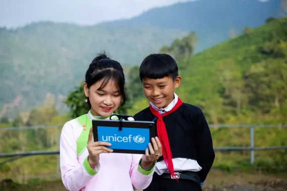 Mong Quynh Chi and Cu A Chuyen from Viet Nam try out Augmented Reality (AR) technology. AR adds digital images and animations on top of the real world (like in Pok&eacute;mon GO).