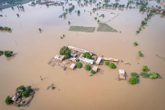 An overhead shot of Flood-submerged homes, roads, and agricultural land in Mahi Wala Village, District Kasur, Punjab.