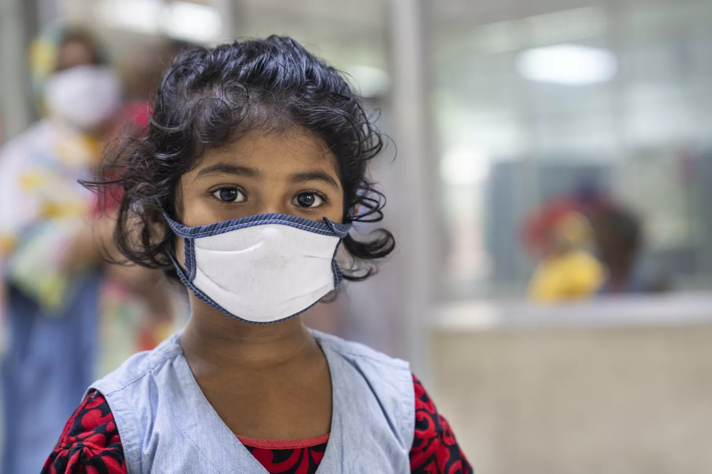 A Bangladesh girl child with a mask.