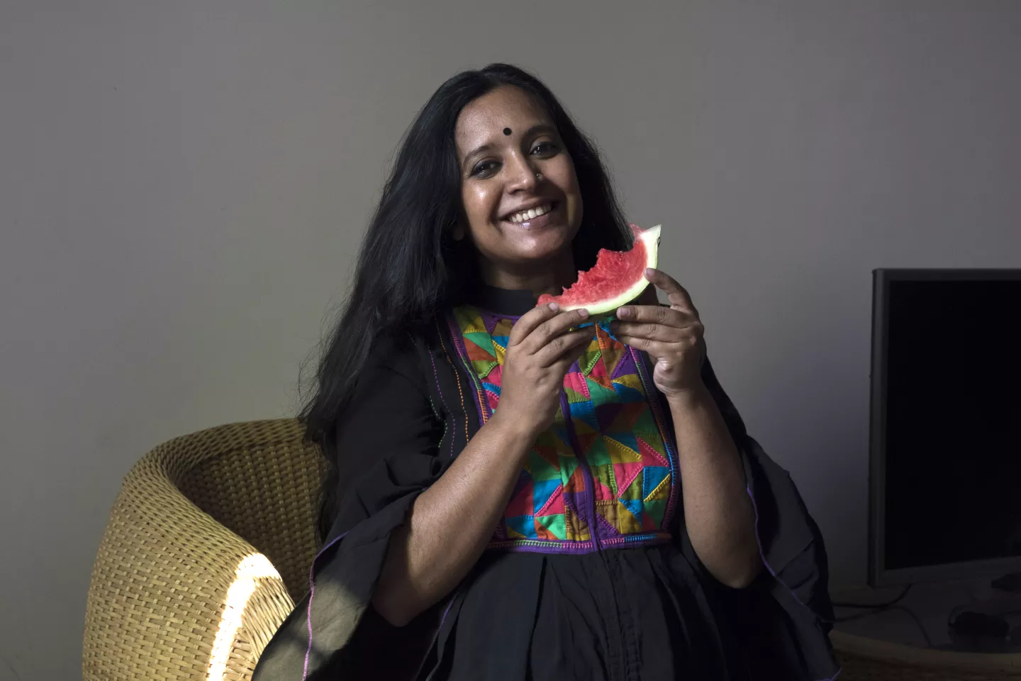 A pregnant mother is eating watermelon. Bangladesh
