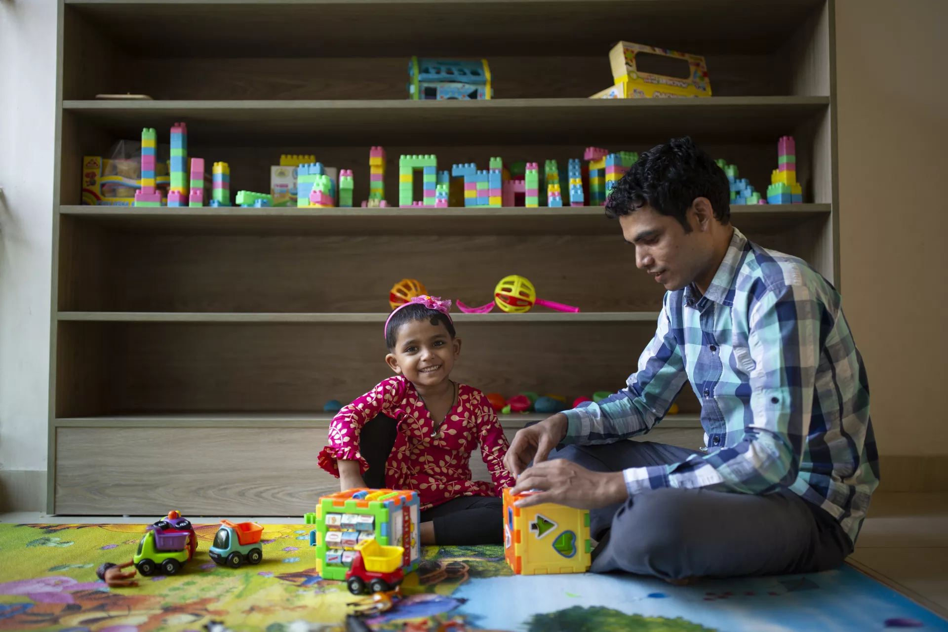 Jamal Hossain, 26, plays with his daughter Jui, in Bangladesh.
