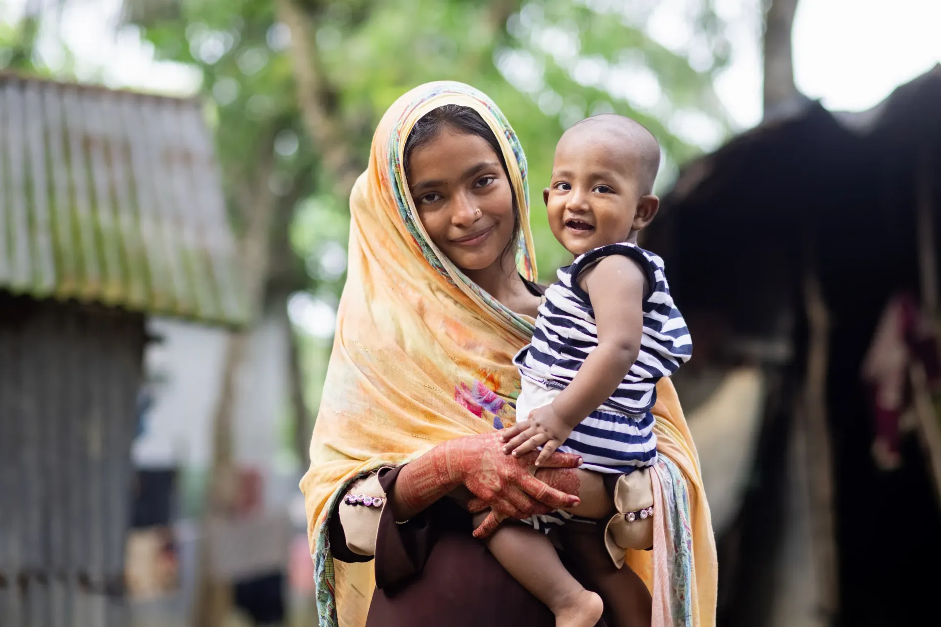  18-year-old Morjina with her son Abu Bakkar at their home in Cumilla, Bangladesh.