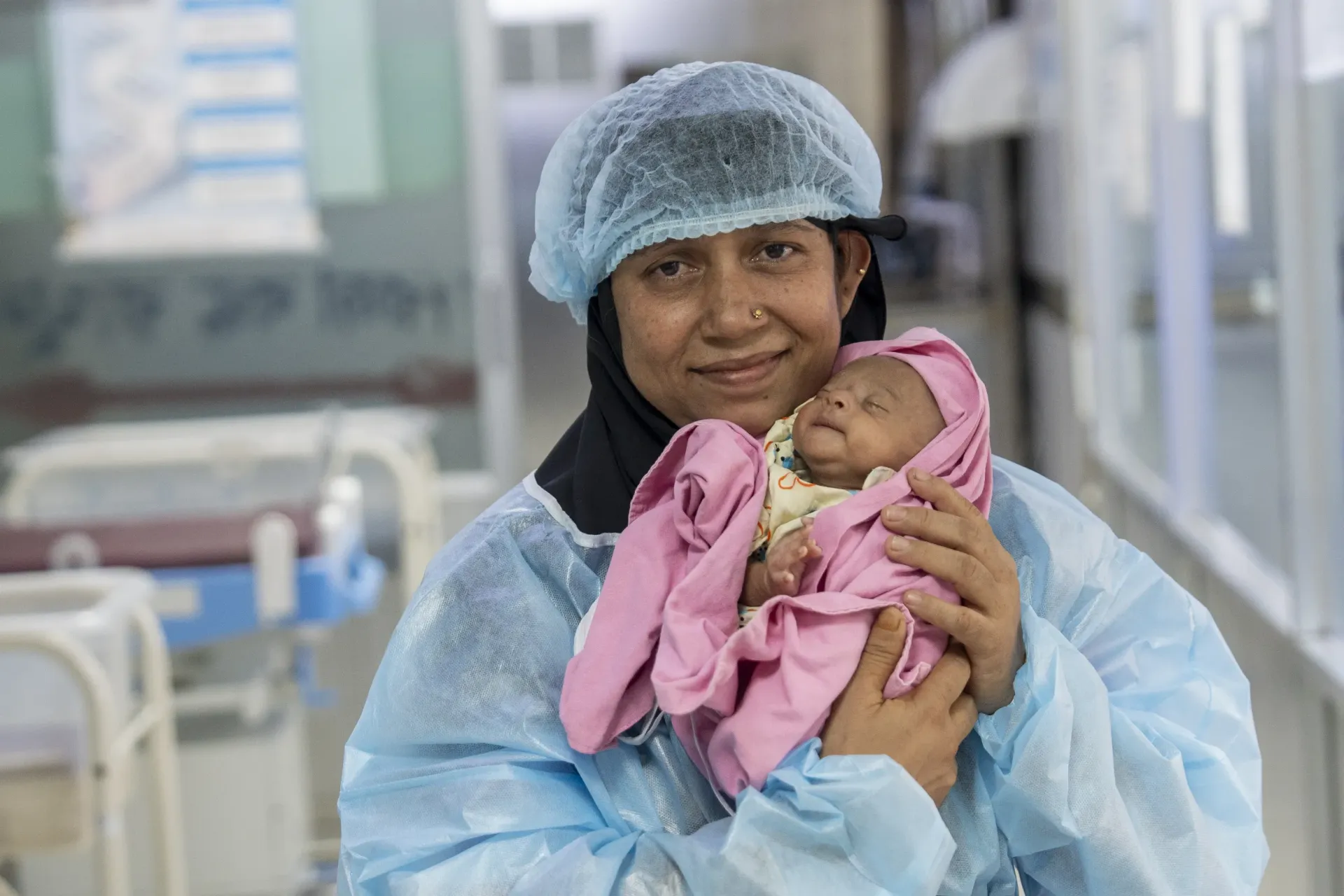 Misnahar, 35, holds her one-month-old child Mir Mohammed Sarid outside the Special Care Newborn Unit (SCANU)in Cox&rsquo;s Bazar District Sadar Hospital.