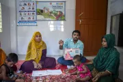 Community health worker Prodip (right) leads the play-based early childhood development session in Bhola.
