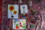 Age-appropriate colourful toys, puzzle cards, and picture books used during the ECD session help spark curiosity, play, and early learning for children during their earliest years of life.