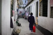 Riyad walks towards Abrar&rsquo;s home with his school bag to pick him up on the way to school.