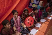 Children from the Korail slum participating in different activities at the makeshift Child Protection Community Hub, established after the original one was engulfed by the fire