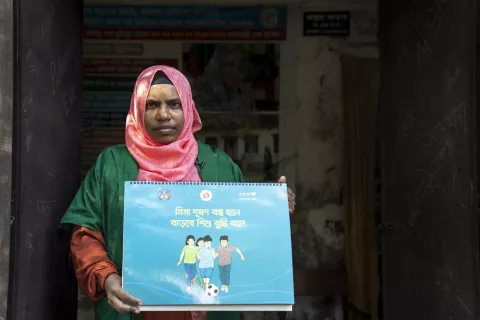 where a 37-year-old community healthcare provider, Asma Akter, is engaged in a community session. 