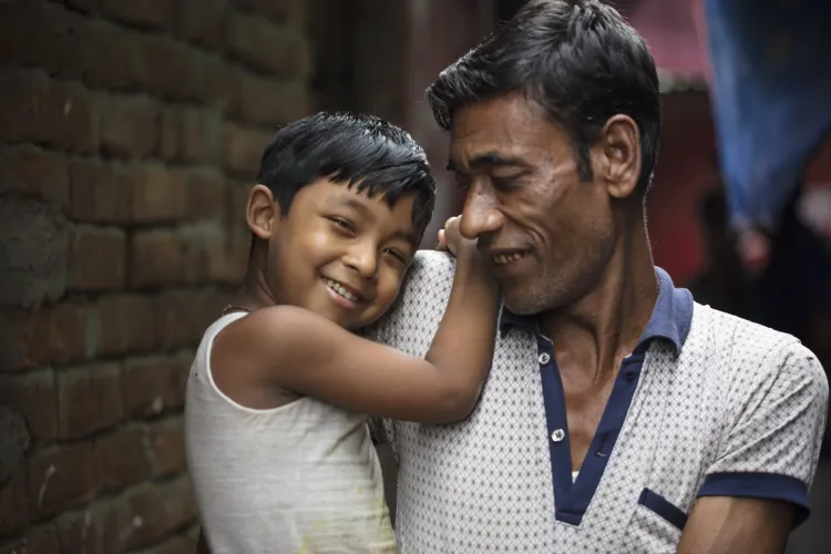 A Bangladeshi child and his father