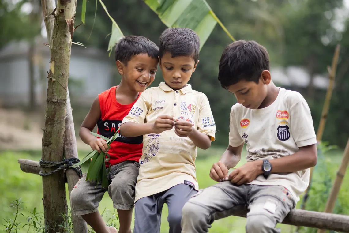 In moments of play, Samiul with his two brothers.