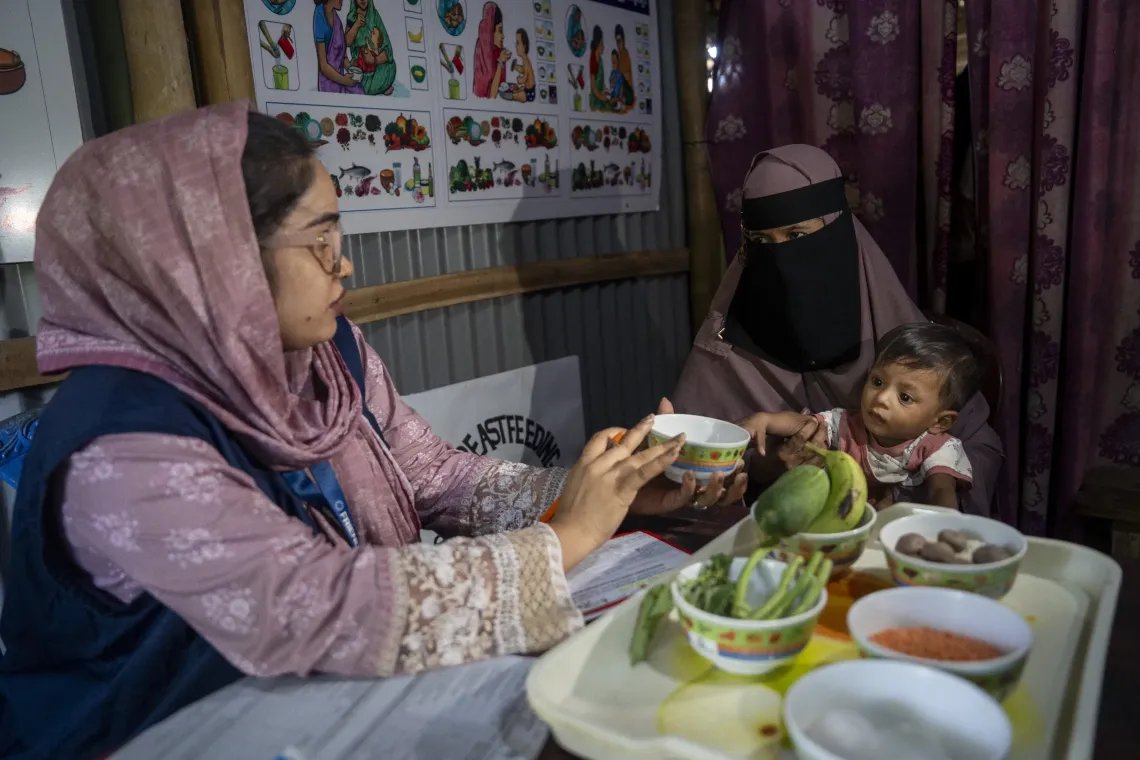 Nutrition counsellor provides guidance to Nur Kayes (22) on complementary feeding. 
