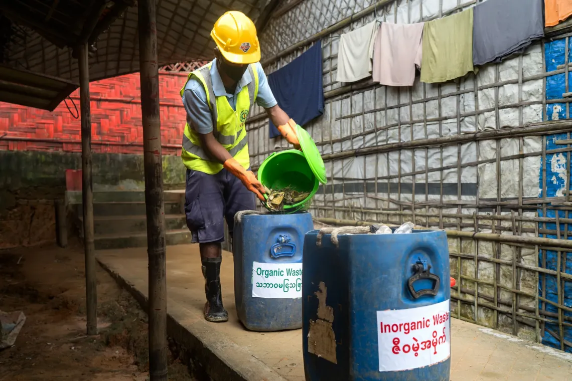 Kamal collecting waste from households. 
