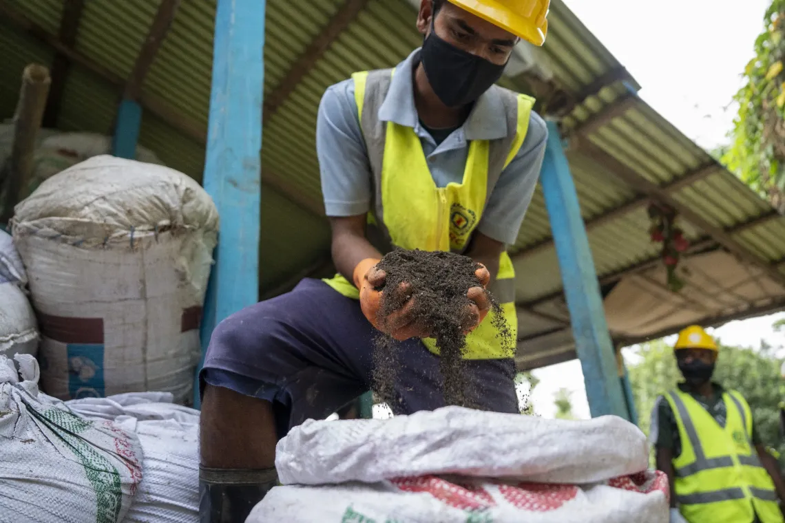 Collected organic waste turned into compost at the waste management facility. 