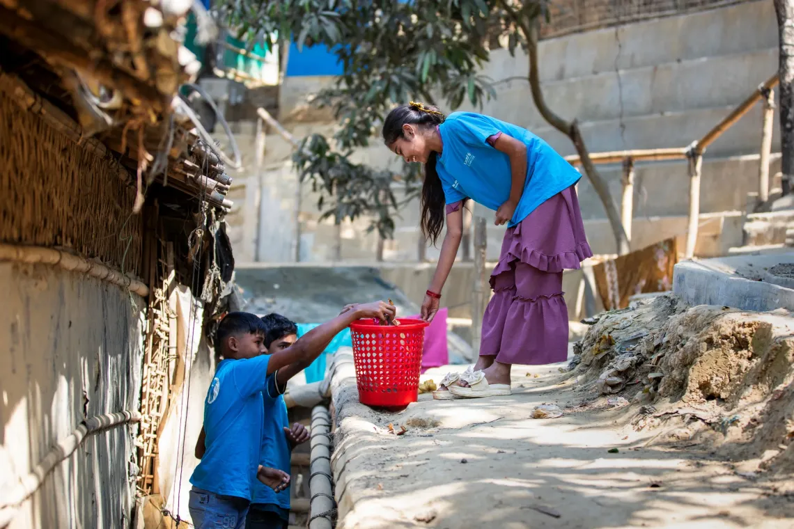Members of the Child Leaders Group clean the neighbourhood and motivate peers 