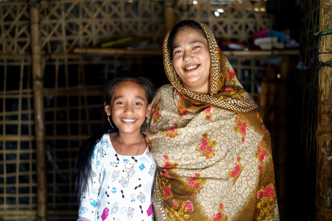 Sabukun with her daughter Rushdi (9) at their home
