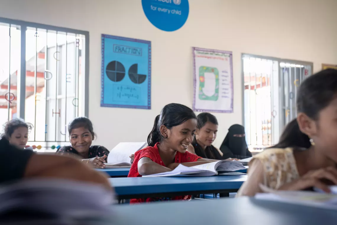 Adolescent girls study in their Grade 7 classroom at the Phoenix Learning Centre.