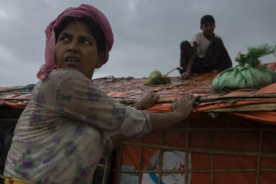 Many Rohingya children were seen sitting on top of their family&rsquo;s shelters in an attempt to keep the plastic roof tops from blowing away. Bangladesh