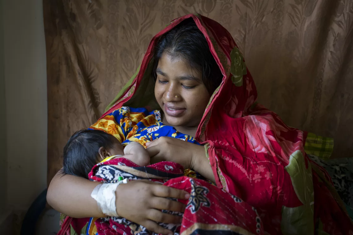 A breastfeeding mother, Bangladesh.