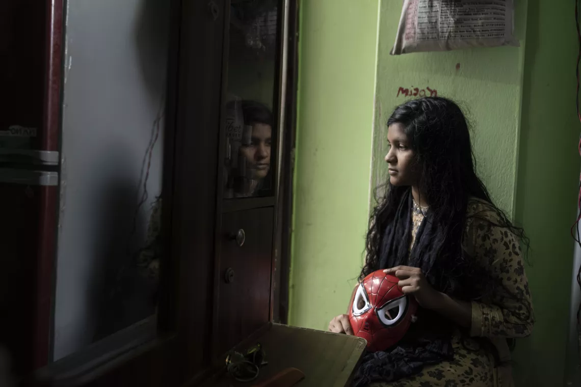 A girl looking at mirror