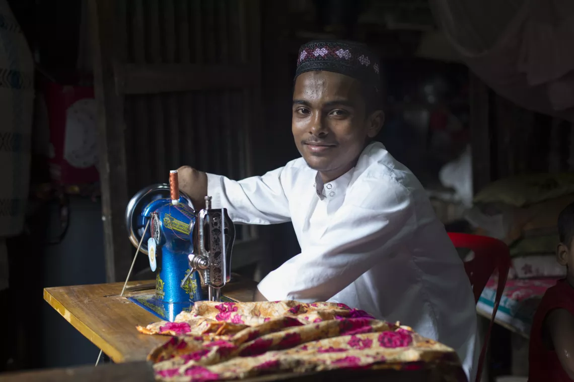 A  disable boy sewing