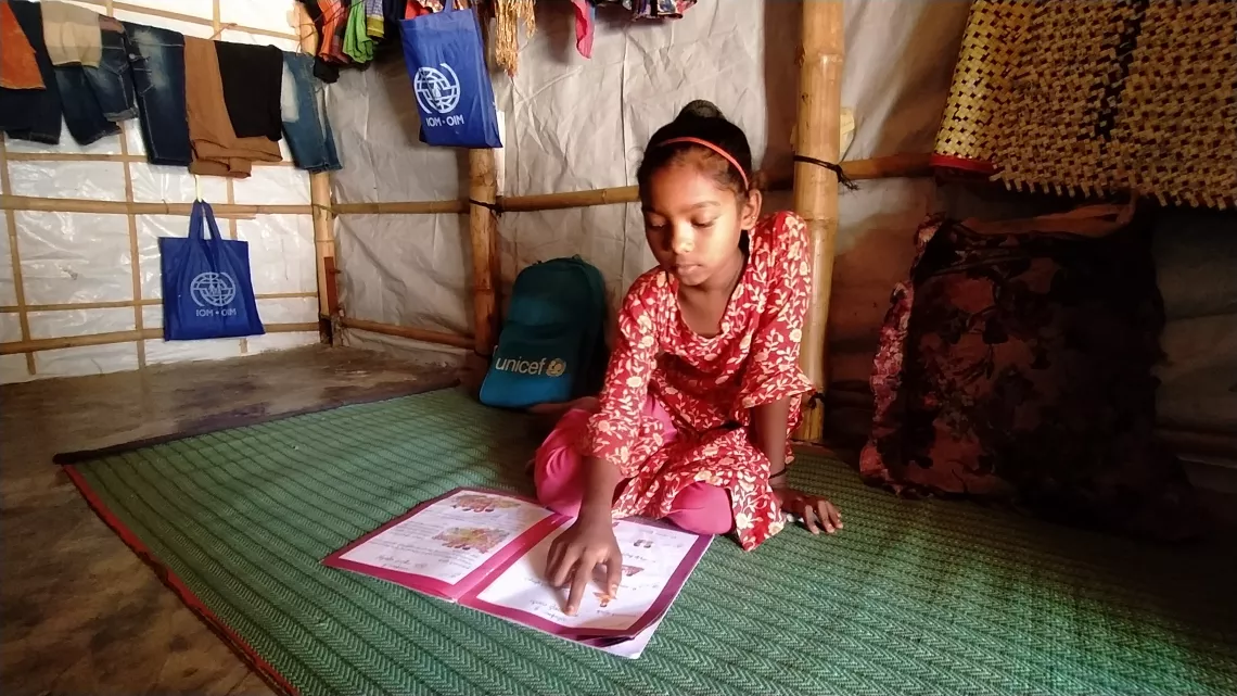 A Rohingya child learns at Learning Centre. Bangladesh