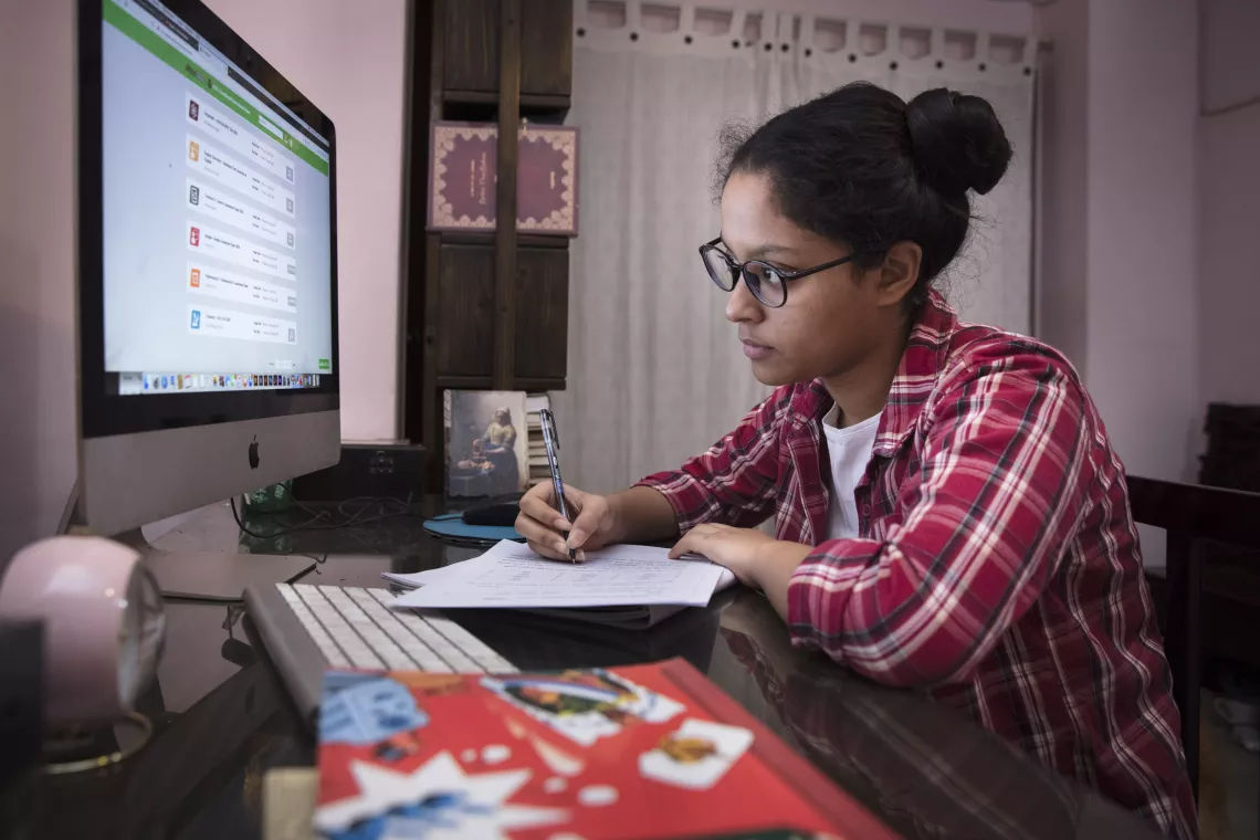 Bangladesh. Agnidrohee Spondon, 17, undertakes an online assessment.