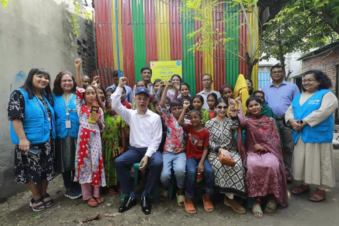 Students, teachers and representatives from UNICEF and AACT celebrate during a visit to the ABAL centre at Jhawchar.