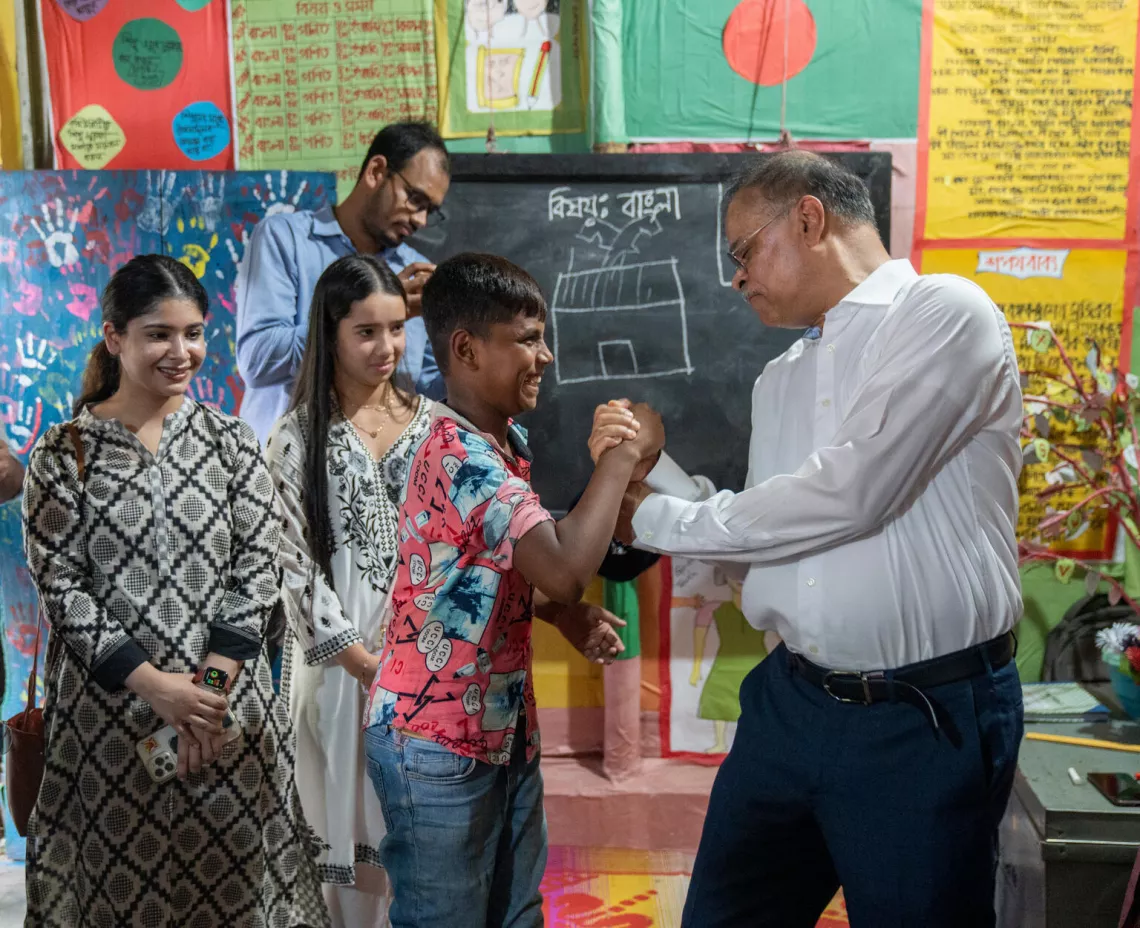 Mr. Aziz Khan arm-wrestles a student of the class during his visit at the ABAL centre at Jhawchar.